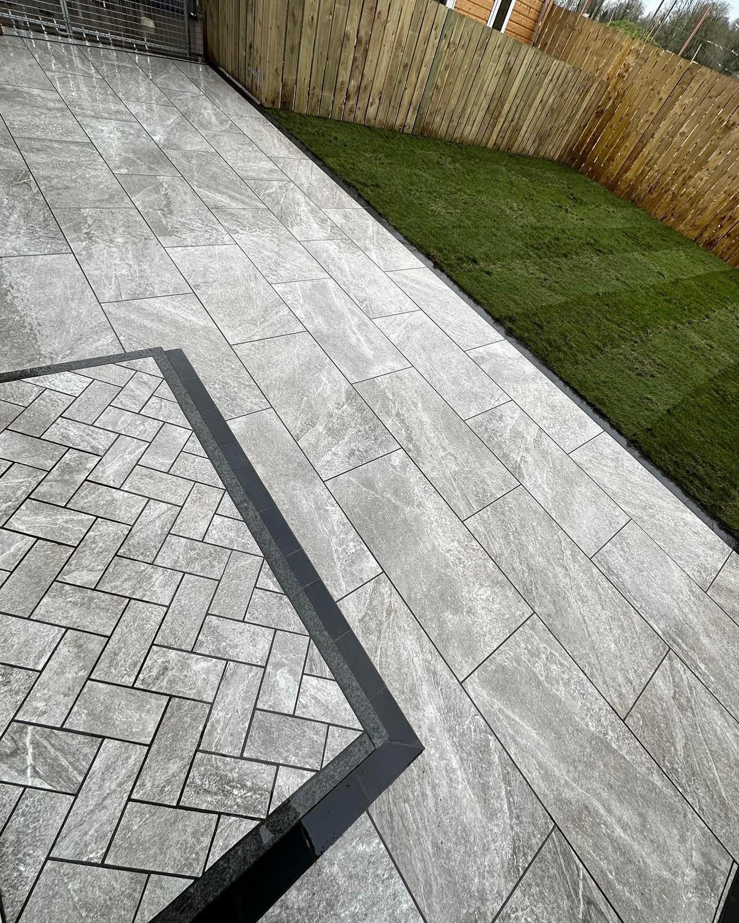 Porcelain patio with herringbone inlay by McCann Paving & Tiling, Belfast