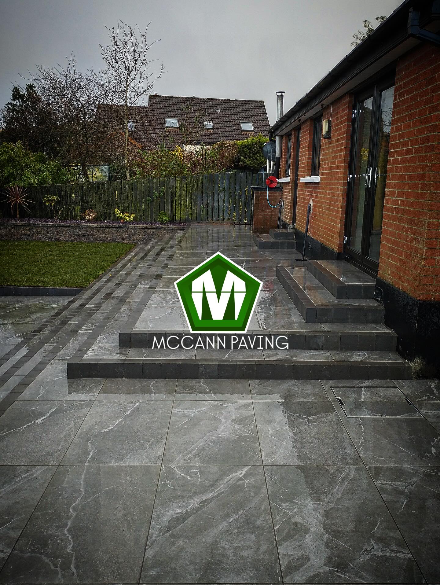 Full rear garden transformation — porcelain patio, steps and landscaping