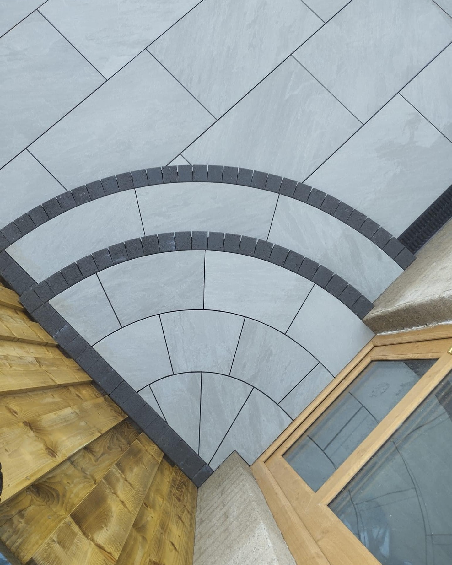 Precision arc step feature — natural stone with curved block border